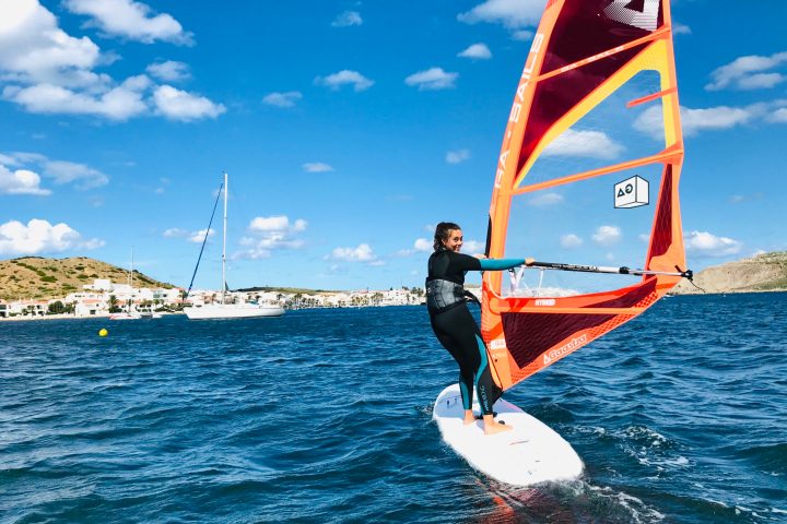a person riding a surf board on a body of water