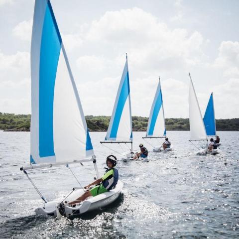 A group of kids sailing