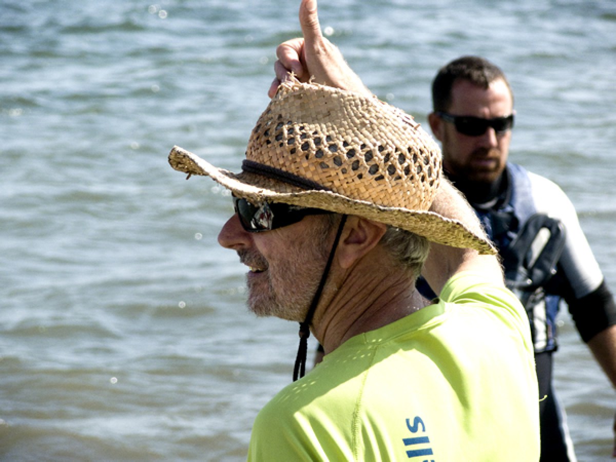 a man that is standing in the water