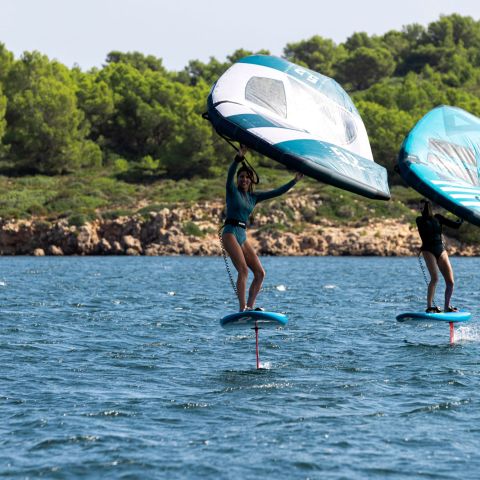 a person riding a surf board on a body of water