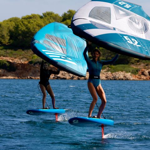 a person riding a surf board on a body of water