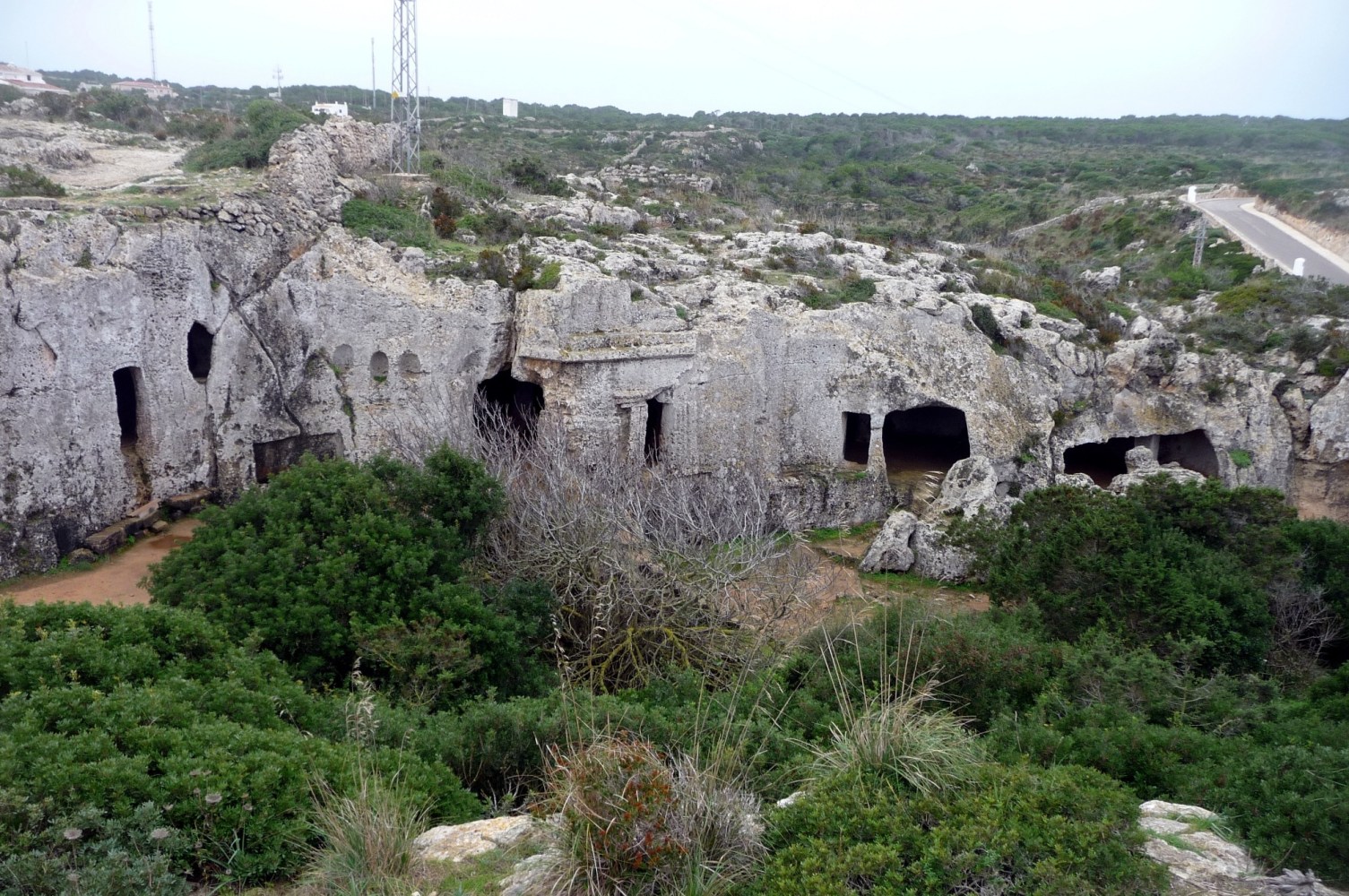 a view of a stone building with a mountain in the background